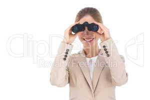 Businesswoman holding binoculars