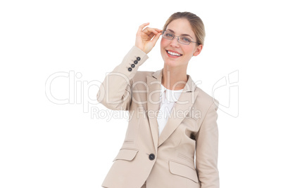 Smiling businesswoman holding her glasses