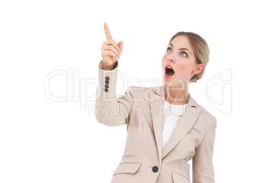 Surprised businesswoman pointing something