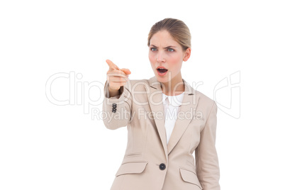 Confused businesswoman pointing something