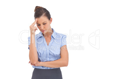 Pretty businesswoman thinking with closed eyes