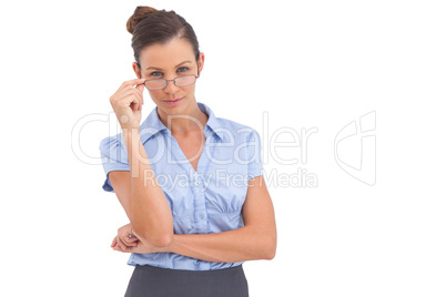 Businesswoman adjusting her glasses