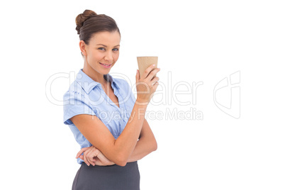 Classy businesswoman holding coffee cup