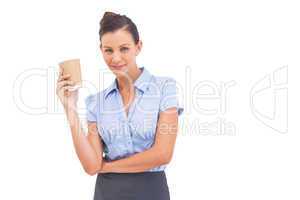 Stylish businesswoman holding cup of coffee