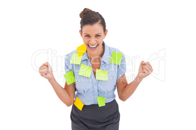 Businesswoman triumphing with adhesive notes