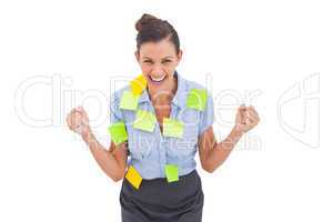 Businesswoman triumphing with adhesive notes