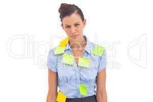 Upset businesswoman with adhesive notes