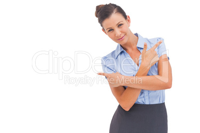 Smiling businesswoman indicating something Smiling businesswoman indicating something