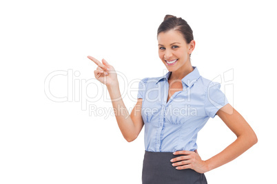 Cheerful businesswoman indicating something