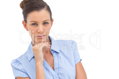 Serious businesswoman with hand on chin