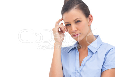 Thinking businesswoman with hand on head