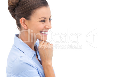 Laughing businesswoman with hand on chin