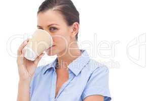 Pretty businesswoman drinking coffee