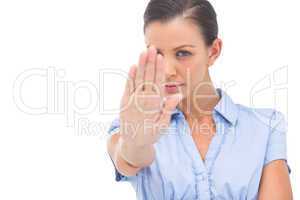 Businesswoman saying stop with hand