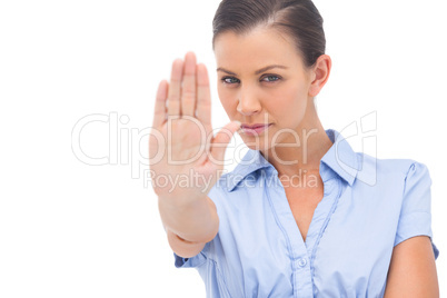 Businesswoman showing stop with hand
