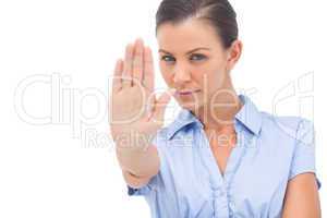 Businesswoman showing stop with hand