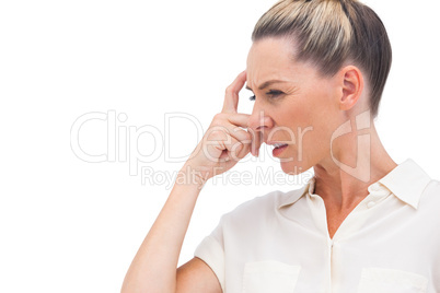 Confused businesswoman with hand on forehead