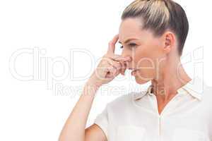 Confused businesswoman with hand on forehead