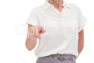 Businesswoman indicating something with finger