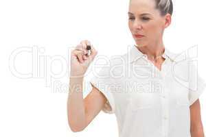 Businesswoman looking at pen in her hand