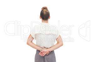 Businesswoman with hands behind her back
