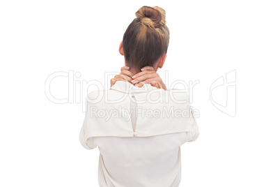 Businesswoman with hand on her neck