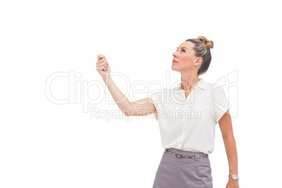 Businesswoman holding her hand and looking up
