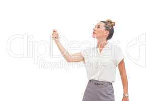 Businesswoman holding her hand and looking up