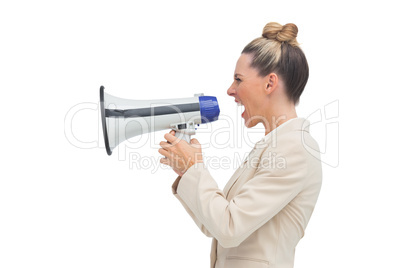 Side view of a blonde businesswoman using megaphone