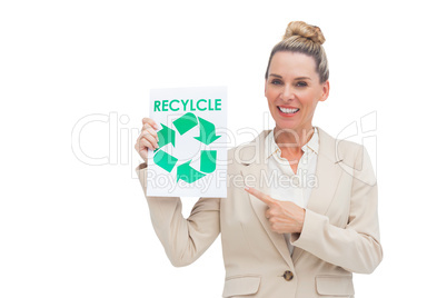 Smiling businesswoman promoting recycling and environment