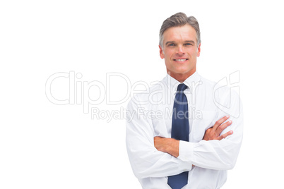 Friendly businessman with crossed arms Friendly businessman with crossed arms