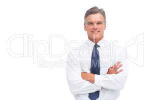 Friendly businessman with crossed arms