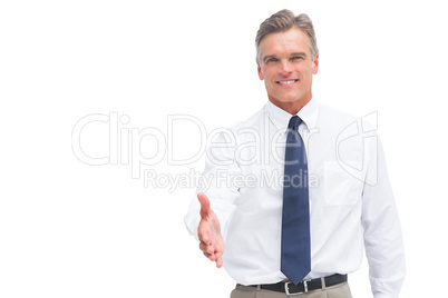 Smiling mature businessman ready to shake hand