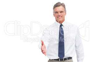 Smiling mature businessman ready to shake hand