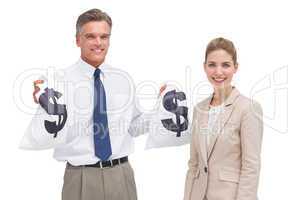 Smiling mature businessman and coworker showing money bags