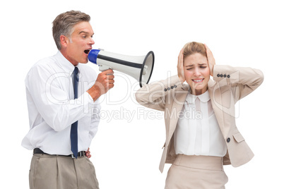 Businessman yelling at his coworker with megaphone