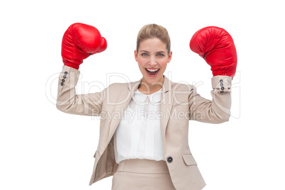 Cheering businesswoman with boxing gloves