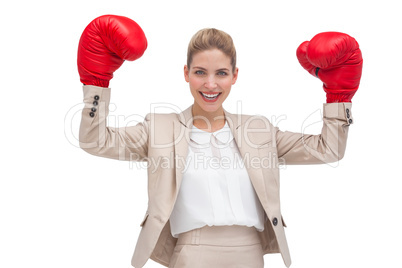 Smiling businesswoman with boxing gloves