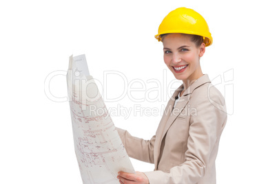 Side view of architect holding construction plan