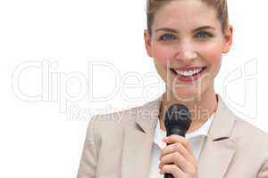 Classy businesswoman holding microphone