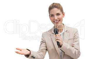 Businesswoman holding microphone