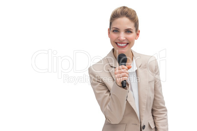 Smiling businesswoman holding microphone