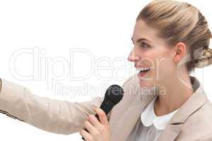 Side view of businesswoman with microphone