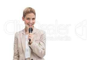 Stylish businesswoman holding microphone