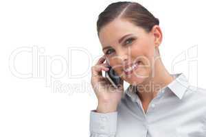 Smiling business woman talking on mobile phone