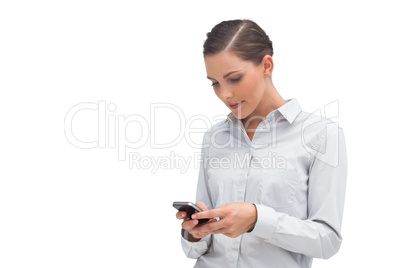 Businesswoman sending text message