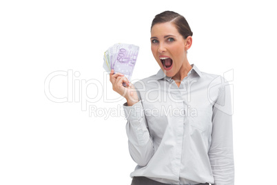 Cheerful businesswoman showing lot of money