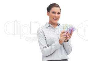 Businesswoman showing lots of money