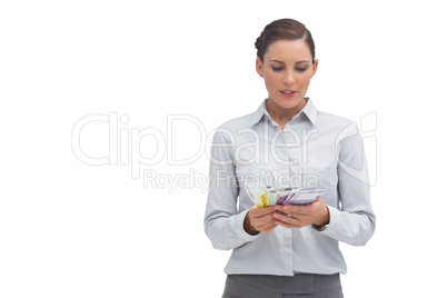 Businesswoman counting euro notes
