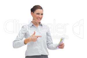 Happy businesswoman with money in her hand